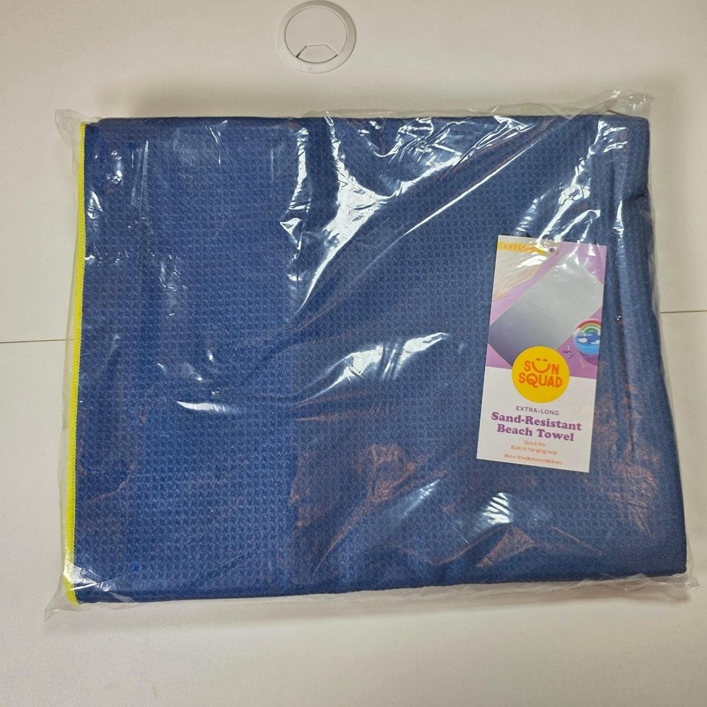 One New Sun Squad Extra-Long Sand-Resistant Beach Towel
